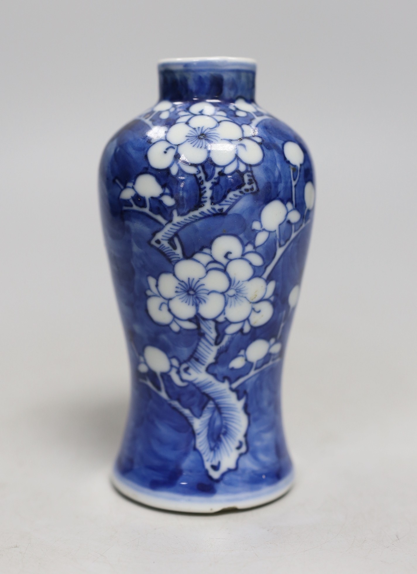 A small 19th century Chinese blue and white prunus vase. 13.5cm tall